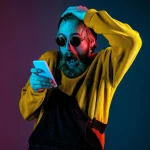 Caucasian man's portrait isolated on gradient studio background in neon light